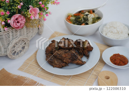 traditional Indonesian food arranged neatly on a table surface traditional Indonesian food arranged neatly on a table surface 122086310
