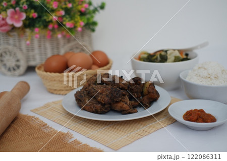 traditional Indonesian food arranged neatly on a table surface traditional Indonesian food arranged neatly on a table surface 122086311