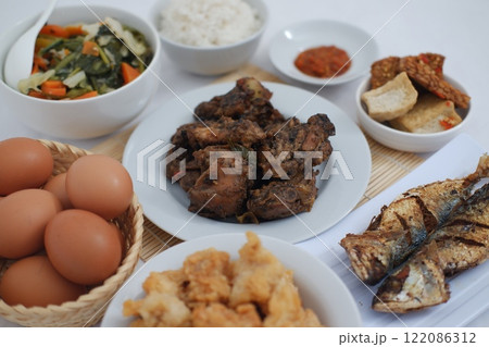 traditional Indonesian food arranged neatly on a table surface traditional Indonesian food arranged neatly on a table surface 122086312