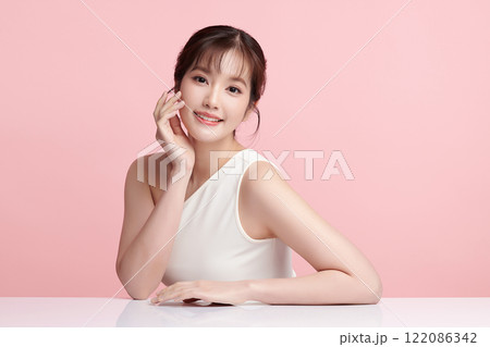 Beautiful young asian woman with clean fresh skin on pink background, Face care, Facial treatment, Cosmetology, beauty and spa, Asian women portrait. 122086342