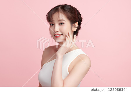 Beautiful young asian woman with clean fresh skin on pink background, Face care, Facial treatment, Cosmetology, beauty and spa, Asian women portrait. 122086344