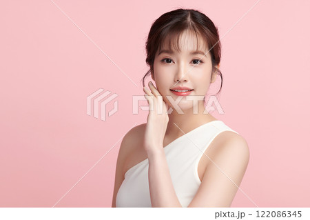 Beautiful young asian woman with clean fresh skin on pink background, Face care, Facial treatment, Cosmetology, beauty and spa, Asian women portrait. 122086345