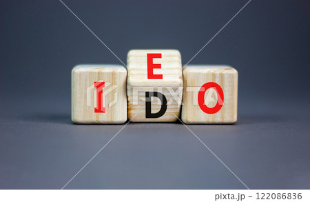 Initial exchange or DEX offering symbol. Concept words abbreviation IEO or IDO on wooden block. Beautiful grey table grey background. Business Initial exchange or DEX offering concept. Copy space. Initial exchange or DEX offering symbol. Concept words abbreviation IEO or IDO on wooden block. Beautiful grey table grey background. Business Initial exchange or DEX offering concept. Copy space. 122086836
