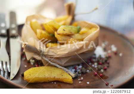 Fried potatoes with spices in a rural style Fried potatoes with spices in a rural style 122087912