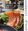 Salmon sashimi on black plate, japanese food in restaurant. 122088099