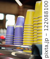 Many yellow and purple disposable paper cups 122088100