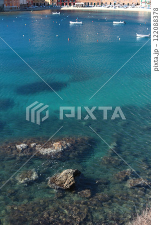 Water of azure sea and stones. Sunny weather. Vacation in Liguria. Nature and meditation. Mountains and sun in summer. Water of azure sea and stones. Sunny weather. Vacation in Liguria. Nature and meditation. Mountains and sun in summer. 122088378