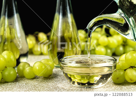 Wine White Natural Vinegar Pouring Into Gravy Bowl Wine White Natural Vinegar Pouring Into Gravy Bowl 122088513