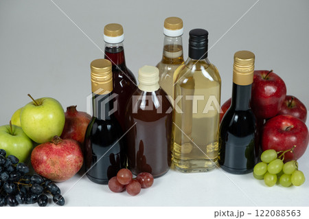 Different types of vinegar, apple, balsamic, wine and pomegranate vinegars in bottles Different types of vinegar, apple, balsamic, wine and pomegranate vinegars in bottles 122088563