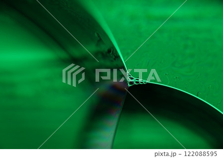 Green liquid surface, fantastic bubbles in the darkness, dark fantastic background, transparent forms, empty space, dark background 122088595