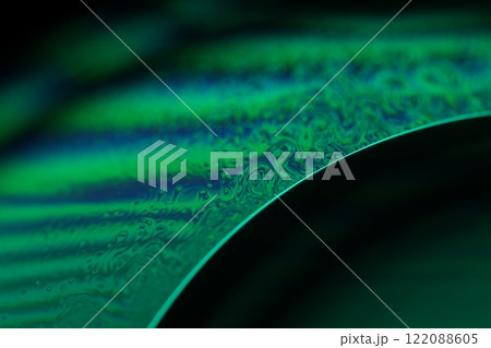 Green liquid surface, fantastic bubbles in the darkness, dark fantastic background, transparent forms, empty space, dark background 122088605