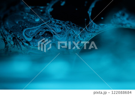 Bright blue liquid surface on black background, oil stains movement, bright chemistry, surreal background, blue sky colour 122088684