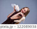 Celebration Fashion A Glamorous Girl Posing with a Beautiful Cake while Wearing High Heels 122089038