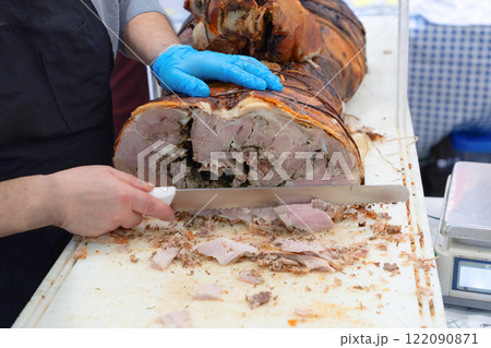 a large loaf of fresh farm ham and sausage ready for sale a large loaf of fresh farm ham and sausage ready for sale 122090871