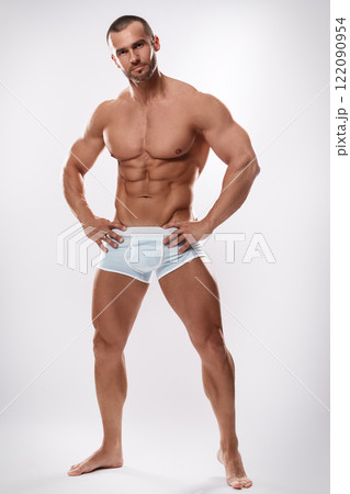 Handsome man posing wearing underwear on white background Handsome man posing wearing underwear on white background 122090954