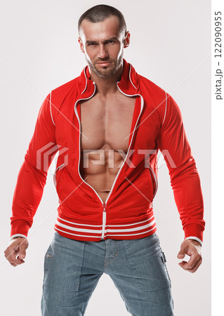 Handsome and muscular man in red jacket Handsome and muscular man in red jacket 122090955