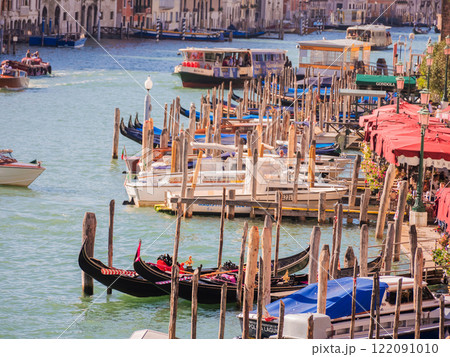 Landscape with Rialto Bridge and gondola Grand Canal in Venice, Italy, Europe. 122091010