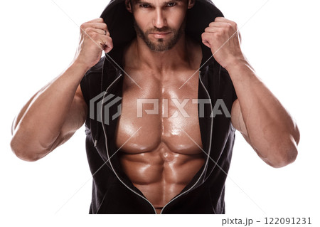 Handsome muscular man posing in studio on white background 122091231