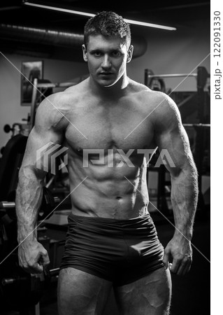 Muscular man in gym Muscular man in gym 122091330