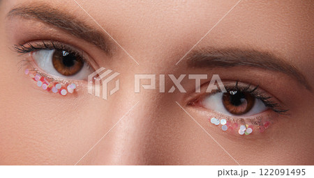 Closeup of female eyes with artistic makeup Closeup of female eyes with artistic makeup 122091495