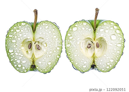 Two halves of green apple covered with water droplets on white background 122092051