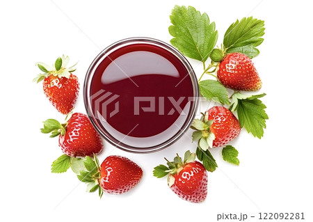 Glass bowl of strawberry juice surrounded by fresh strawberries and leaves Glass bowl of strawberry juice surrounded by fresh strawberries and leaves 122092281