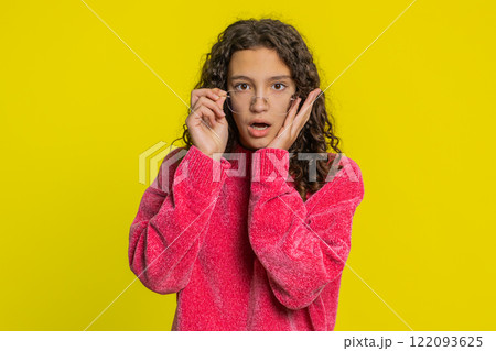 Excited amazed girl surprise looking at camera with big eyes shocked by sudden victory wow emotion 122093625