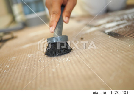 The cleaning process involves the thorough sweeping away of dust using a brush The cleaning process involves the thorough sweeping away of dust using a brush 122094032