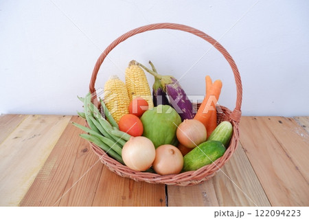 Basket of fresh vegetables on a wooden table. Healthy food. Basket of fresh vegetables on a wooden table. Healthy food. 122094223