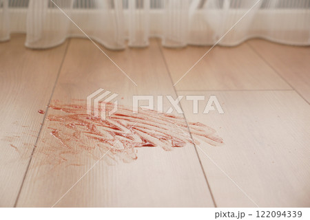 Tomato stain on a wooden floor Tomato stain on a wooden floor 122094339