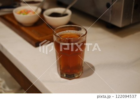 hot tea in glass on table. Selective focus and shallow depth of field. 122094537