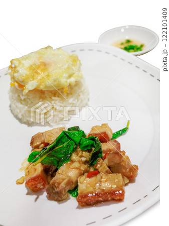Top view of Stir Fried Spicy Crispy Pork with Basil On Rice and Fried Egg, focus selective Top view of Stir Fried Spicy Crispy Pork with Basil On Rice and Fried Egg, focus selective 122101409