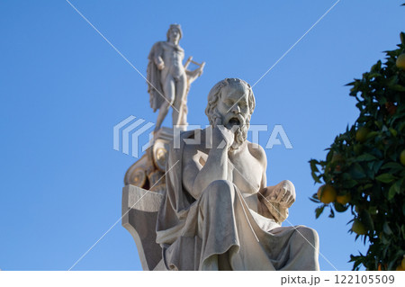 Marble statue of Greek philosopher Socrates. God Apollo on background. Marble statue of Greek philosopher Socrates. God Apollo on background. 122105509