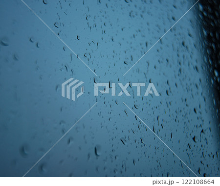 Wet window glass with raindrops cold weather Wet window glass with raindrops cold weather 122108664