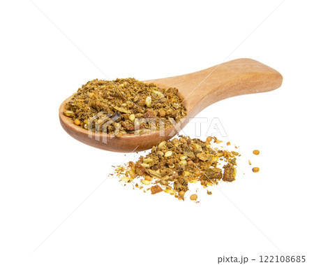 Dried aromatic spices in wooden spoon isolated on the white background 122108685