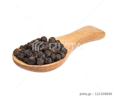 Dried aromatic full pepper spices in wooden spoon isolated on the white background Dried aromatic full pepper spices in wooden spoon isolated on the white background 122108690