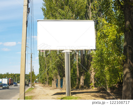 Commercial empty billboard with copyspace near road and trees Commercial empty billboard with copyspace near road and trees 122108717
