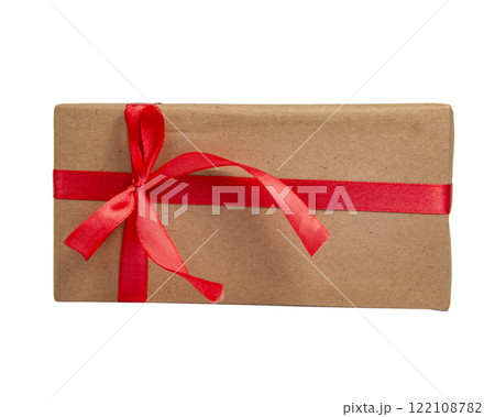 Craft gift box with red color bow isolated on the white background with copyspace Craft gift box with red color bow isolated on the white background with copyspace 122108782