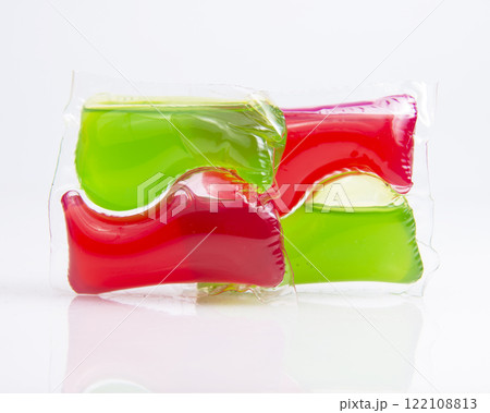 Red green capsule for cloth washing liquid powder isolated on the white background Red green capsule for cloth washing liquid powder isolated on the white background 122108813