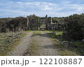 Rustic wooden gate with dry stone wall in a rural countryside 122108887