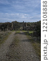 Rustic wooden gate with dry stone wall in a rural countryside 122108888