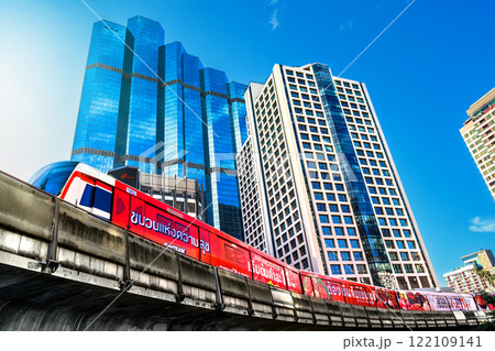 The Bangkok Skytrain (BTS), a symbol of Thailand advancing transportation and business sectors, operates seamlessly through the modern urban landscape of the city 122109141