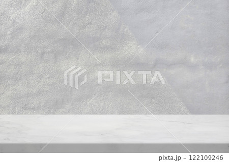 Marble Table with White Stucco Wall Texture Background with Light Beam and Shadow 122109246