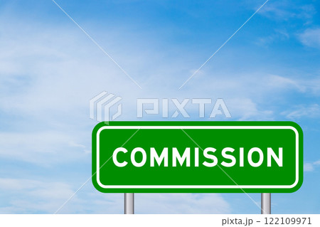 Green color transportation sign with word commission on blue sky with white cloud background Green color transportation sign with word commission on blue sky with white cloud background 122109971