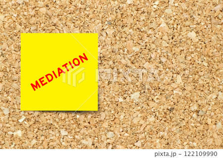 Yellow note paper with word mediation on cork board background with copy space Yellow note paper with word mediation on cork board background with copy space 122109990