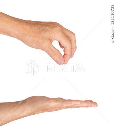 Elderly caucasian woman's hand open with palm up, fingers slightly curled, wrinkled skin, expressive 122110735