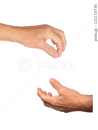 Elderly caucasian woman's hand open with palm up, fingers slightly curled in a gesture of offering 122110736