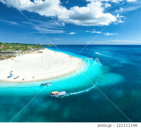 Aerial view of the boats and blue sea with white sandy beach 122111146