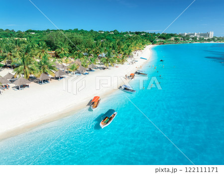 Aerial drone view of boats and sea coast with white sandy beach Aerial drone view of boats and sea coast with white sandy beach 122111171