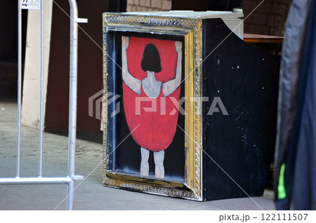 a painting in a gold frame with a cabaret dancer in the courtyard of Moscow 122111507